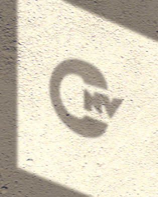 Chivaneve mark projected across a textured architectural surface